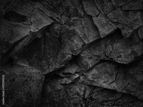 Dark  stone background. Black white rock granite texture. Mountain surfase close-up.  photo