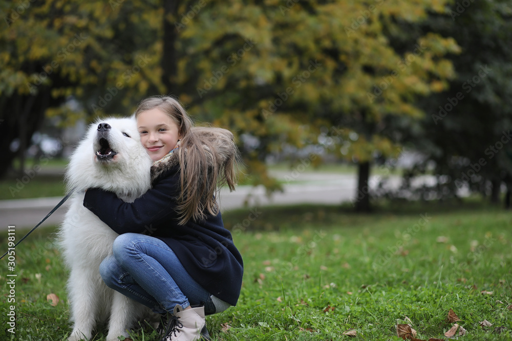 Lovely girl on a walk with a beautiful dog Lovely girl on a walk with a beautiful dog