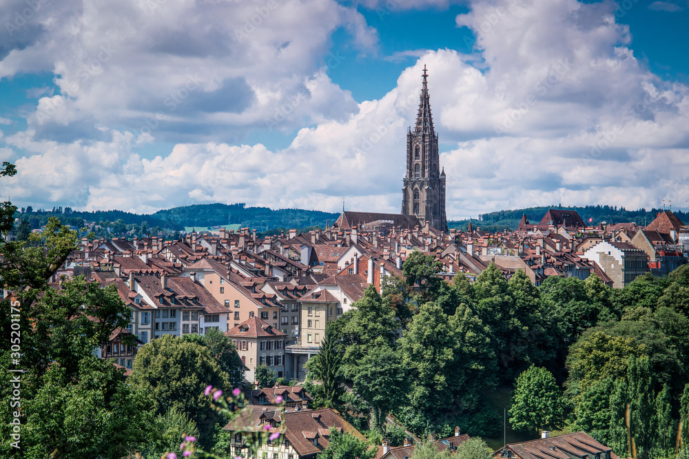 View of the Swiss city of Bern with medieval buildings and clouds in the sky