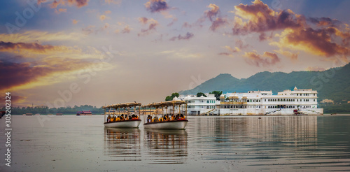 royal Water boats for transport to city palace in udaipur India  photo