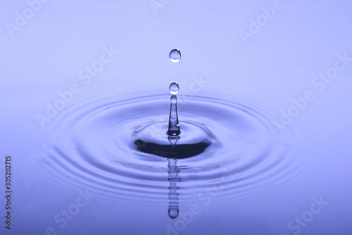 Water Drop Splash on Blue Background