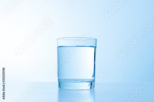 a simple glass of water isolated on white. fresh cool drink