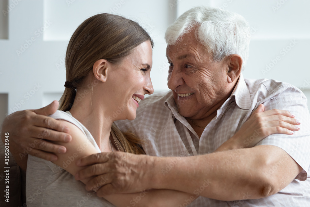 Close up head shot bonding two generations family embracing. Close up head shot bonding two generations family embracing.