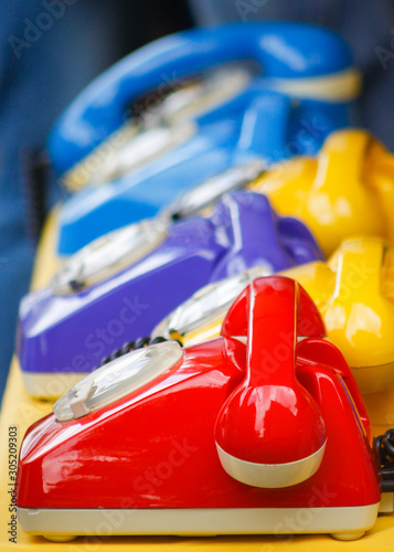 old color retro phone ,  red, yellow and blue
