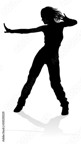 A woman street dance hip hop dancer in silhouette