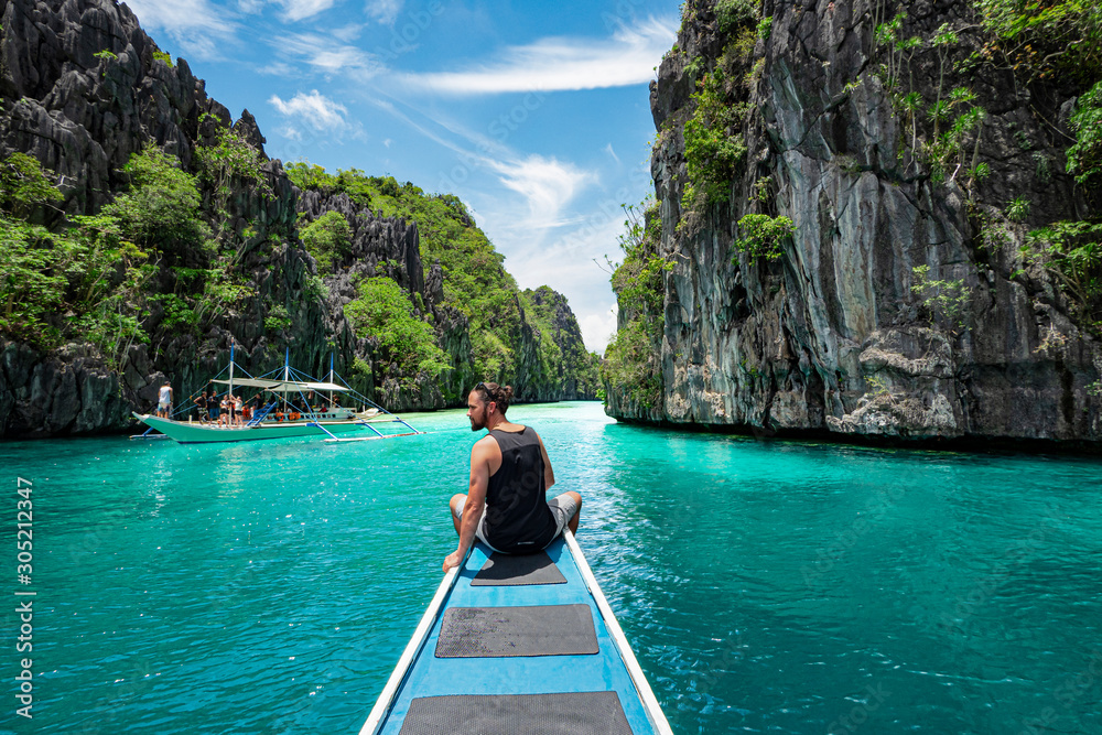 Palawan, Philippines, Traveler on Boat Deck Exploring Natural Sights Around El Nido