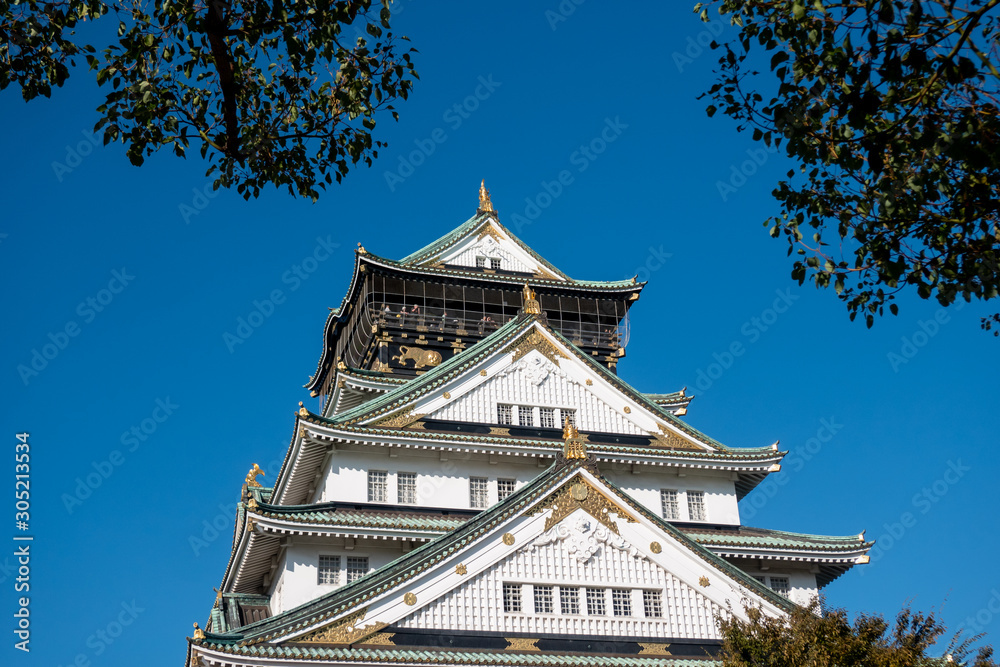 Osaka Castle in Osaka with autumn leaves. Japan Travel Concept Osaka Castle in Osaka with autumn leaves. Japan Travel Concept