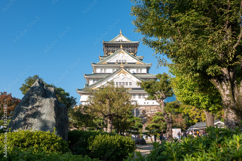 Osaka Castle in Osaka with autumn leaves. Japan Travel Concept Osaka Castle in Osaka with autumn leaves. Japan Travel Concept