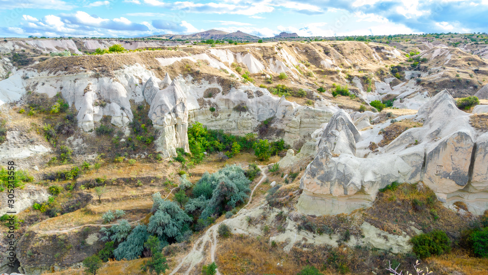 Mountain landscape in Pigeon valley in Cappadocia, Turkey. Unreal rock formations of Cappadocia
