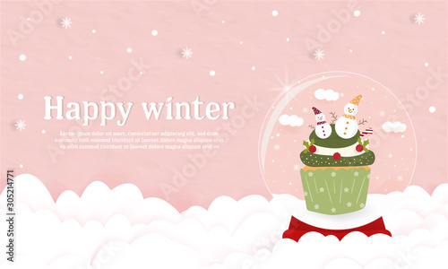 Sweet Christmas cup cake in glass globe decorated with snowman and cherries cover banner.pink paper pastel background on cloud happy winter. bakery party celebration food product cream lover. New Year