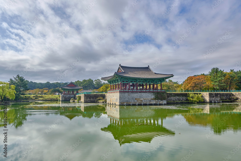 Scenic  view of Donggung Palace and Wolji Pond in national park in Gyeongju in South Korea. Beautiful summer cloudy look of traditional asian style building in middle of pond in Republic of Korea.