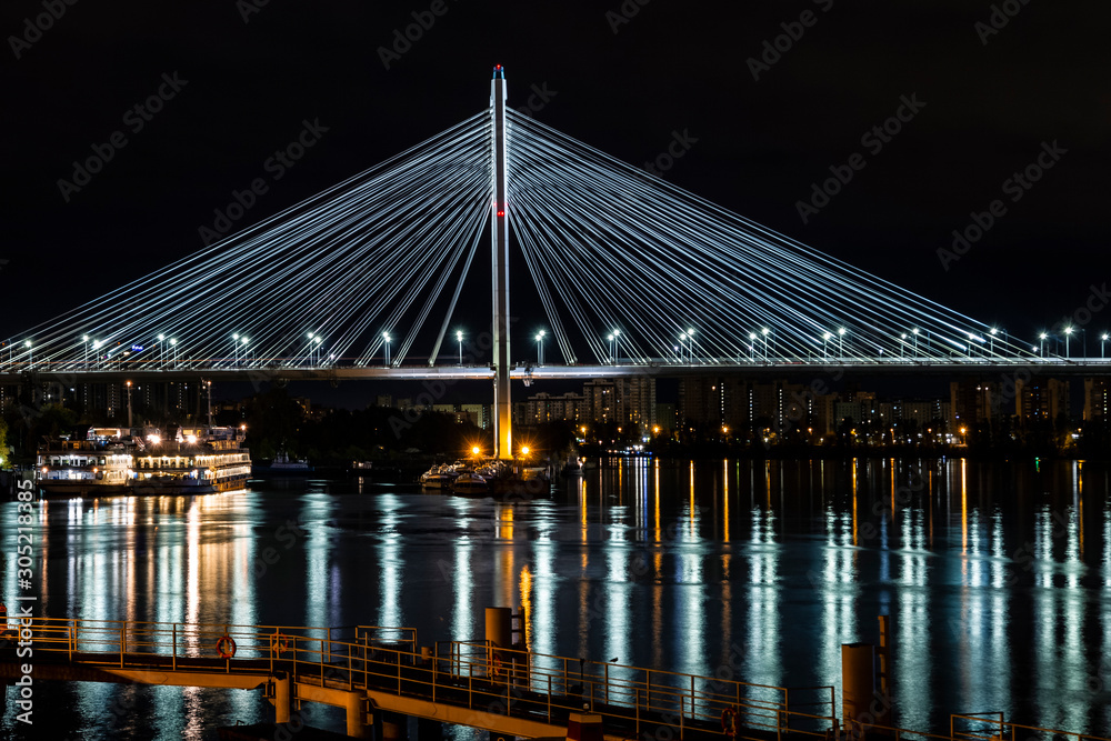 Fototapeta premium bridge at night lights reflected in the river