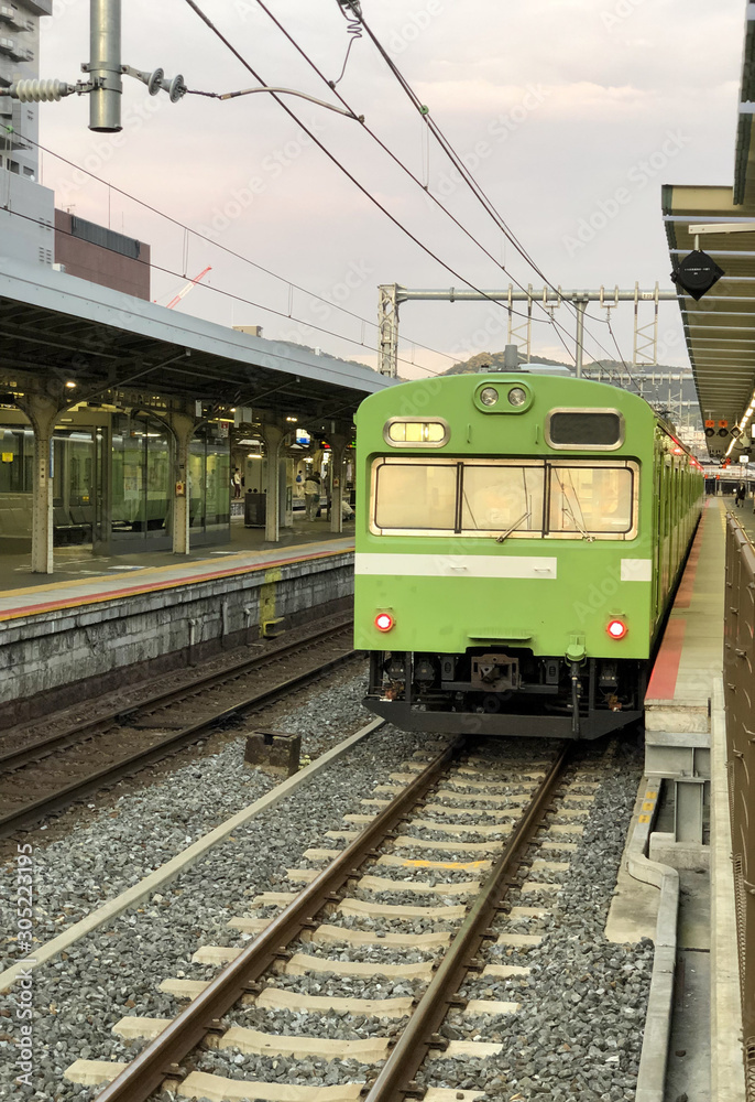 Japanese Suburban Railway.  A train awaiting passengers at the Nara￼ station