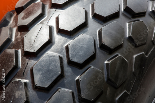 The texture of the treads of a rubber wheel shot close-up