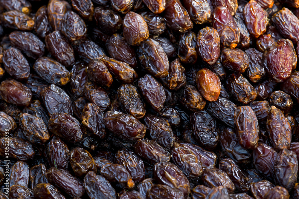 Background of dried dates close-up on a market in Istanbul. Background of dried dates close-up on a market in Istanbul.