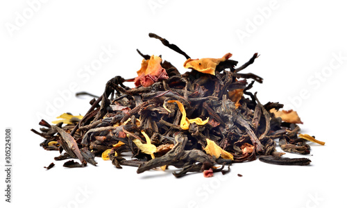 Heap of dried black chinese tea leaves isolated on white background. Close-up.