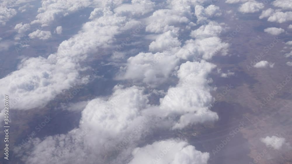 Flying over altocumulus clouds - view from above