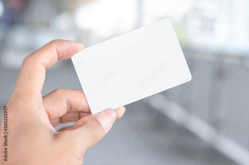 hand holding empty blank white business card mock up design text for advertisement branding. hand holding empty blank white business card mock up design text for advertisement branding.