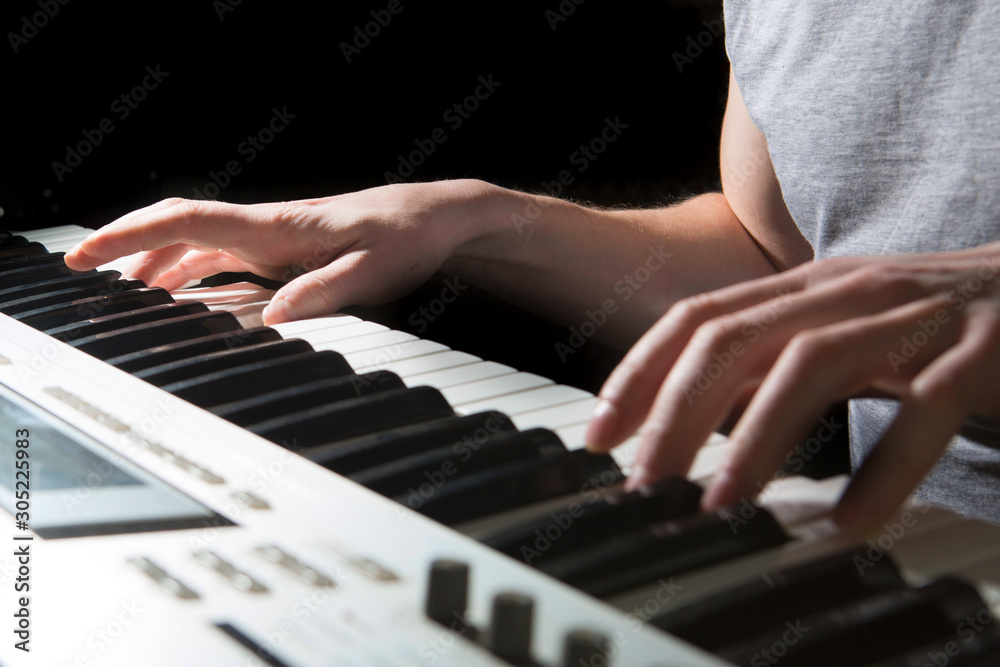 Fototapeta premium Pianist musician piano musical instrument playing. Music piano with man performer.