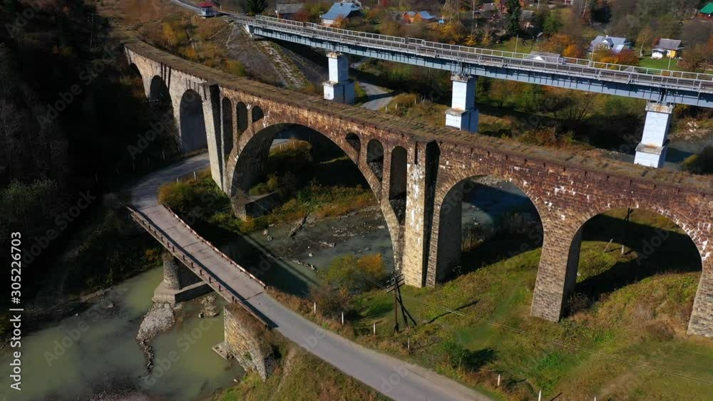 Drone view of old bridge viaduct in mountain village Vorokhta Ukraine Drone view of old bridge viaduct in mountain village Vorokhta Ukraine