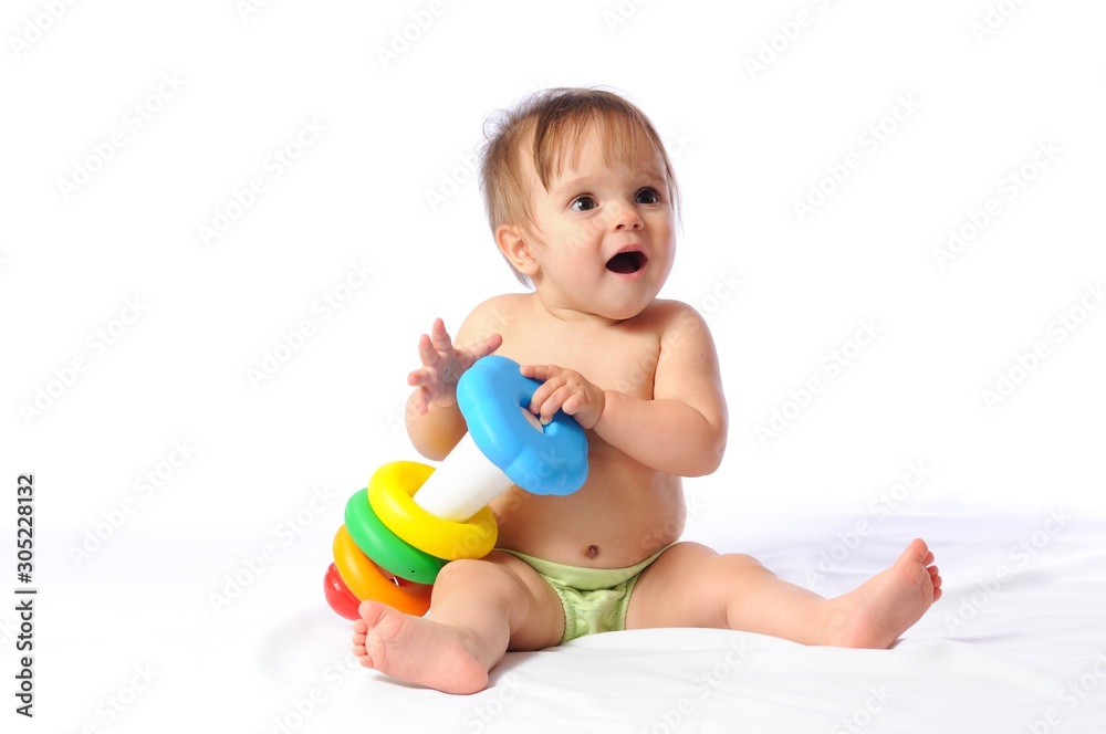 Happy little child rejoice at pyramid toy Happy little child rejoice at pyramid toy