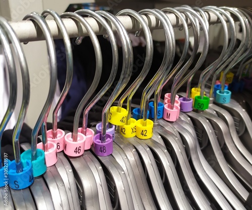 A group of clothes hangers in different sizes
