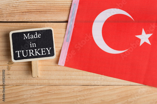 goods and services concept - Turkish country's flag, blackboard with text Made in Turkey