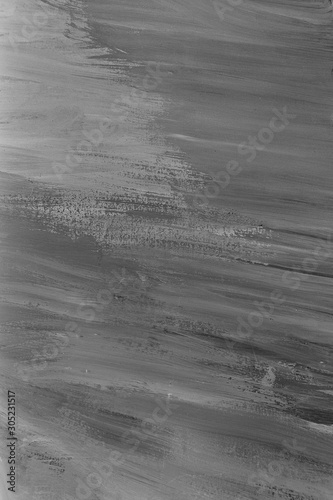 Abstract grey background painted with gouache paint.