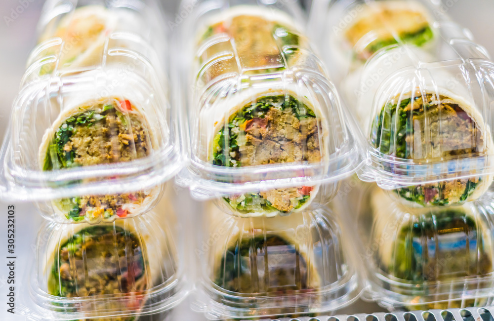 Prepackaged sandwiches displayed in a commercial refrigerator Stock