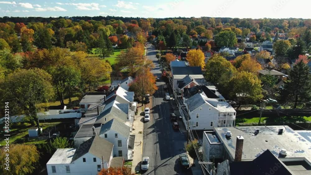 Historic downtown Lititz, Pennsylvania in full Autumn colors, Aerial push shot