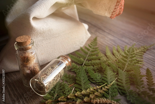 Medicinal herbs in glass packaging.