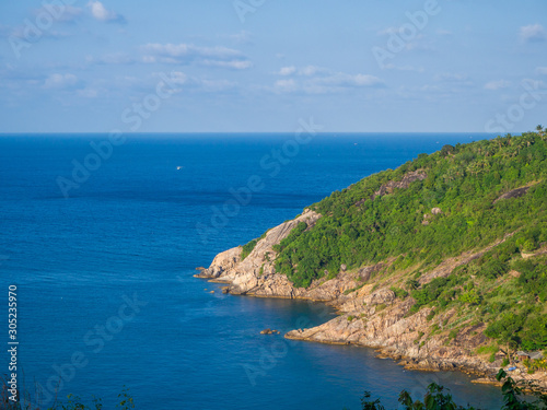 Granite cape with green vegetation. Koh Phangan. Thailand.