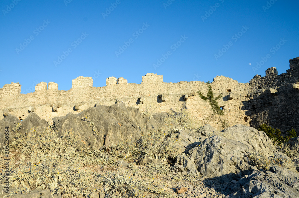  Old fortress, tower and walls. Medieval city. Cultural heritage and architecture.Ancient castle and old city. 