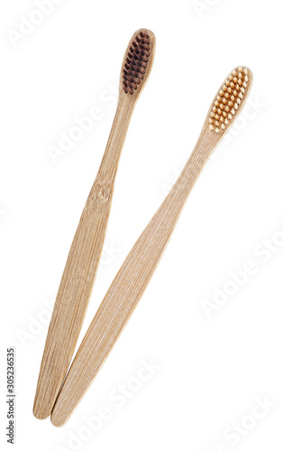 Wooden toothbrush on white background, top view.