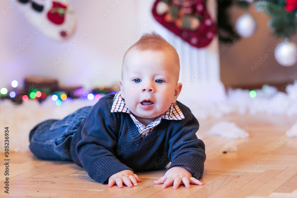 Little boy at home. Christmas, New Year, winter and holidays seasons concept. Little boy at home. Christmas, New Year, winter and holidays seasons concept.