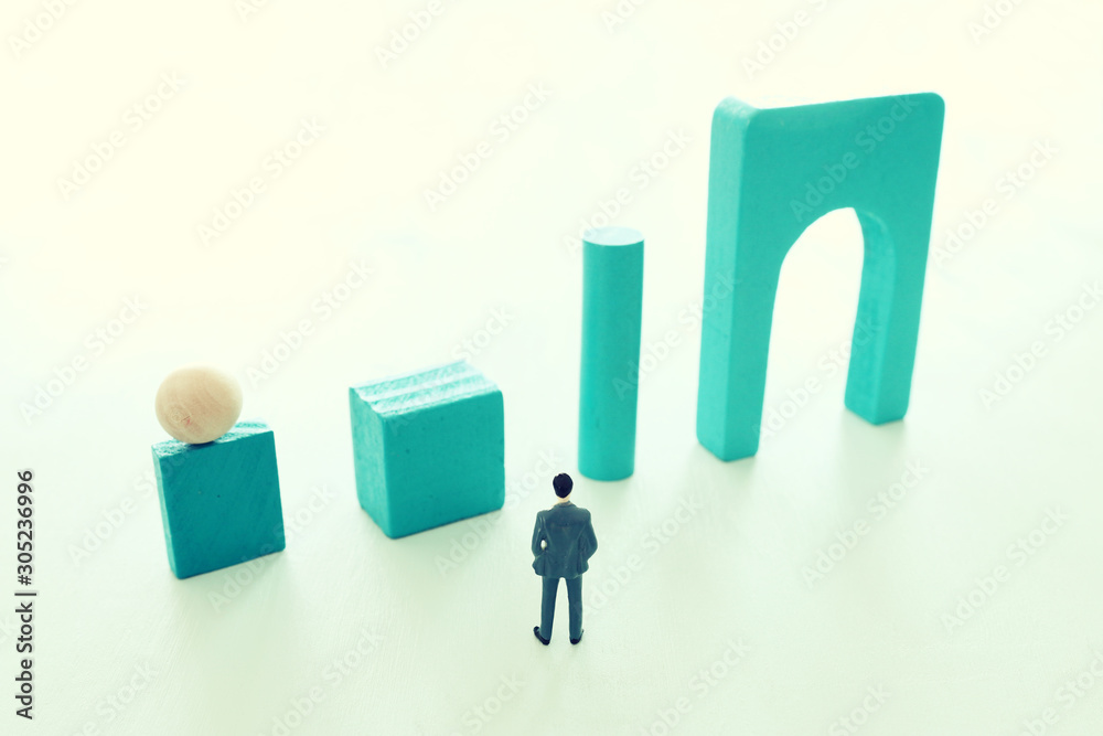 Business concept of problem solving and learning strategy. A businessman faces a challenge that needs to be solved in the most efficient way Business concept of problem solving and learning strategy. A businessman faces a challenge that needs to be solved in the most efficient way