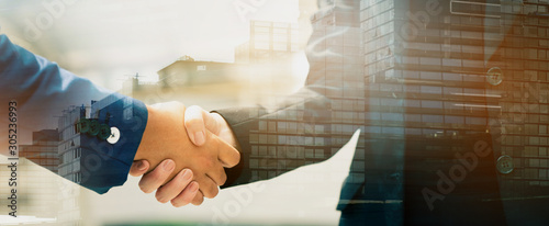 Photography Close up of a business people with a handshake Agreements to do business together show trust and confidence in the investment in real estate