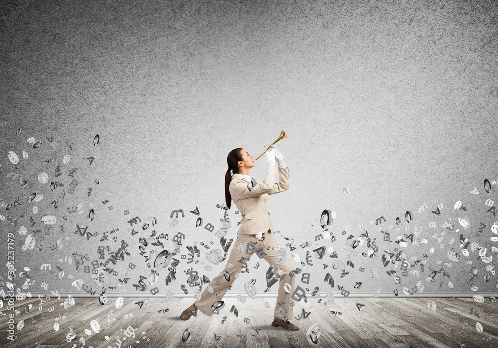 Woman playing trumpet brass instrument Woman playing trumpet brass instrument