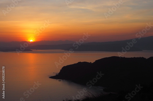 Beautiful and warm sky of sunset time with tropical sea and mountain view. Holidays, travel and nature, new day, inspiration concept © TS.PHOTOS