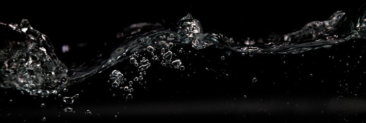Water splashes on black background.