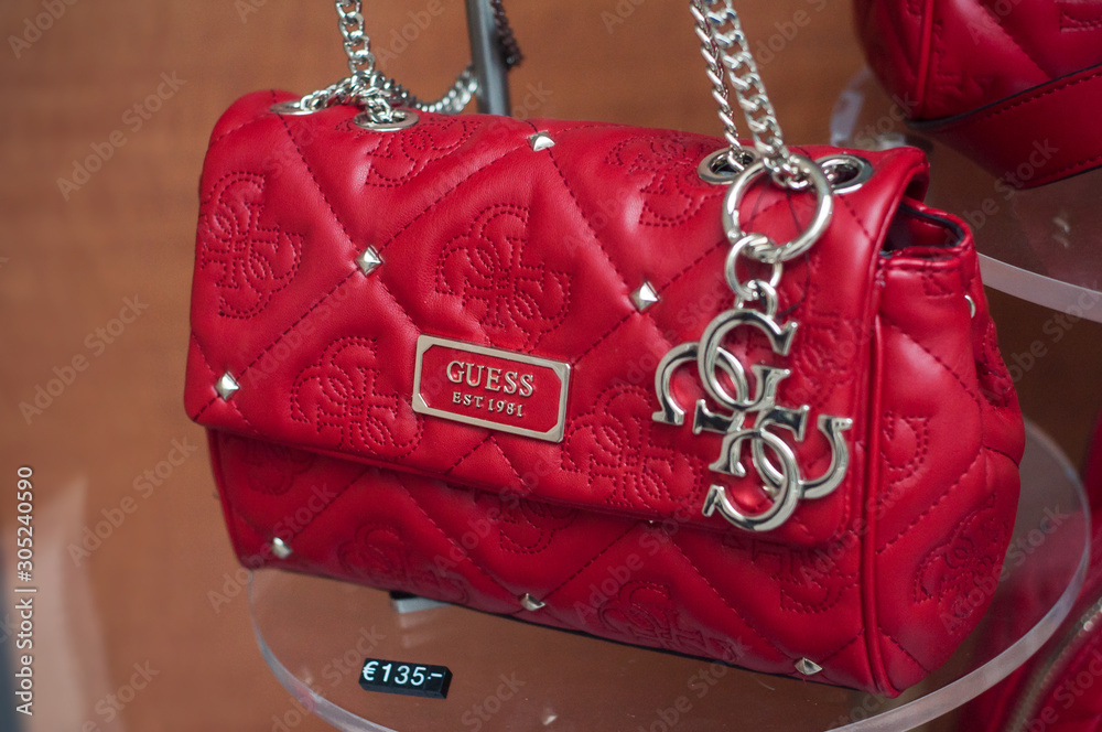 Mulhouse - France - 24 November 2019 - Closeup of red leather handbag by  Guess the famous american brand in a luxury fashinstore showroom Stock  Photo | Adobe Stock