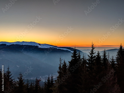 Beautiful sunrise over Sinaia town seen from 1400 m