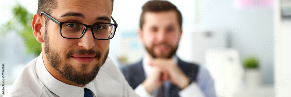Group of smiling bearded businessmen in suit and tie Group of smiling bearded businessmen in suit and tie