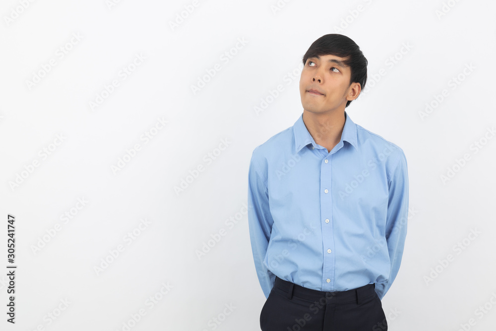 Young handsome asian business man thinking an idea while looking up isolated on white background. Young handsome asian business man thinking an idea while looking up isolated on white background.