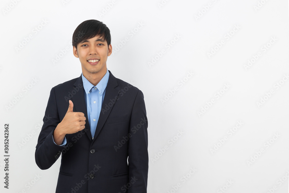 Young handsome asian business man smiling and showing thumbs up isolated on white background. Young handsome asian business man smiling and showing thumbs up isolated on white background.