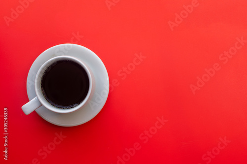 cup of coffee on yellow background. soft focus.