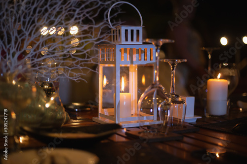 Lamp, candles on the dinner table