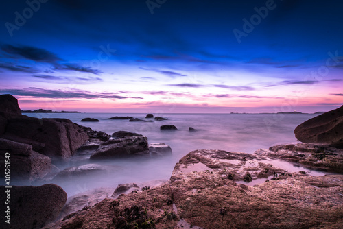 Sunset and smooth water on the pink granit coast in Brittany
