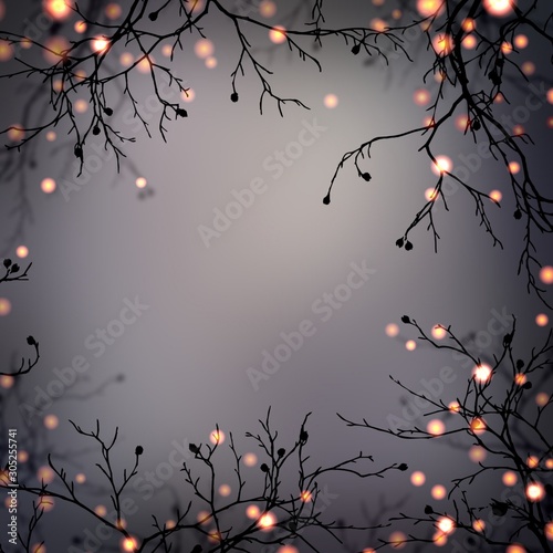 Festive garland on branches frame. Golden lights in mystery night forest. Empty dark grey blurred background. Halloween party mystical decoration. Magical forest.