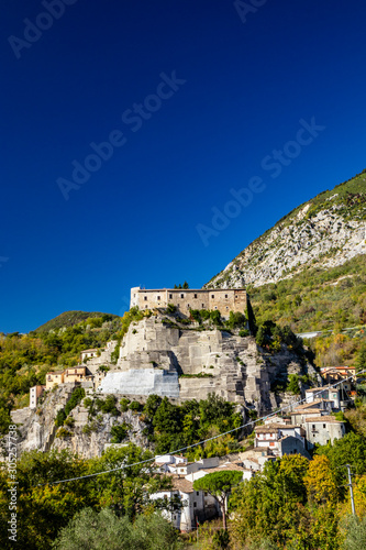 A view of the ancient village of Cerro al Volturno  surrounded by green woods and mountains. The Pandone castle stands on top of the hill  on a rock spur. Isernia  Molise  Italy.
